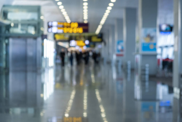 Blurred background. Traveler at airport terminal blur background with bokeh light - Foto, Imagem