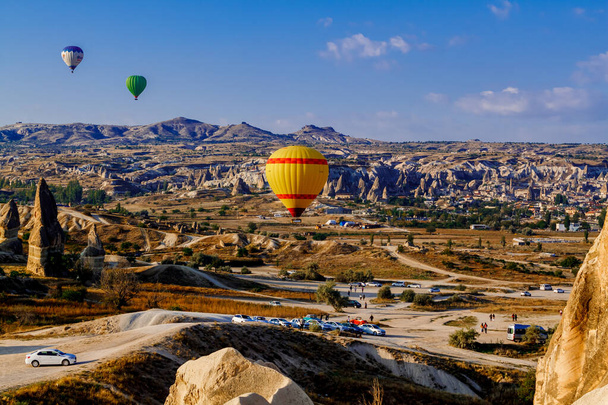 Goreme/Nevsehir, Turkey - 27 September 2019: Colorful hot air balloons flying over the valley at Cappadocia, Anatolia, Turkey. Volcanic mountains in Goreme national park. - Φωτογραφία, εικόνα