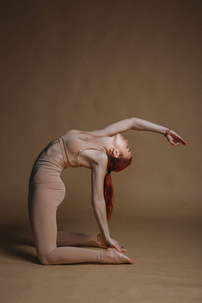attractive girl doing yoga exercises - Photo, Image
