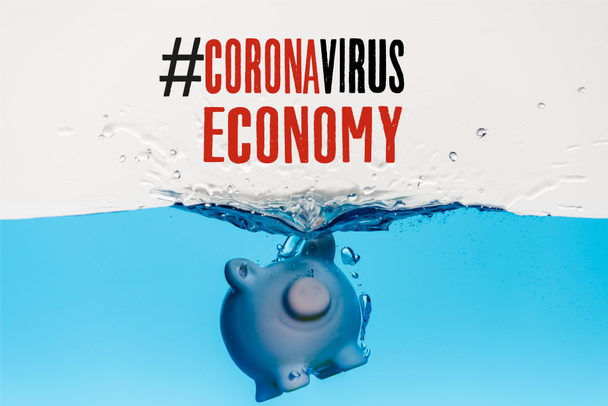 piggy bank going under blue water with splash isolated on white, coronavirus economy illustration - Foto, afbeelding