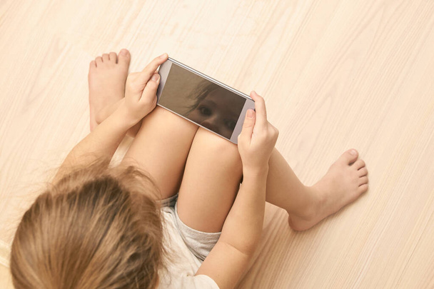 Young person sitting with phone. Perfect for mockup - 写真・画像