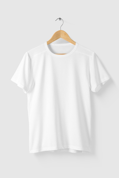Blank White T-Shirt Mock-up on wooden hanger, front side view. High resolution. - Photo, Image