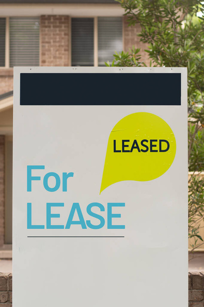 For lease and leased sign on a white display outside of a resedential building - Photo, Image