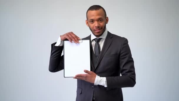 professional african-american business man - presenting holding blank sign - Video