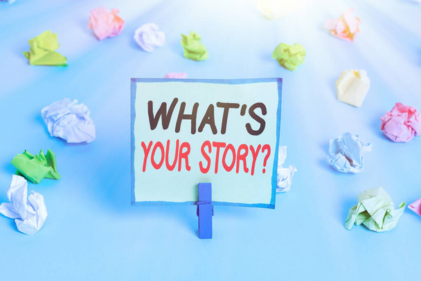 Conceptual hand writing showing Whats Is Your Storyquestion. Business photo showcasing manner of asking demonstrating about past events Colored crumpled papers empty reminder blue floor clothespin. - Photo, Image