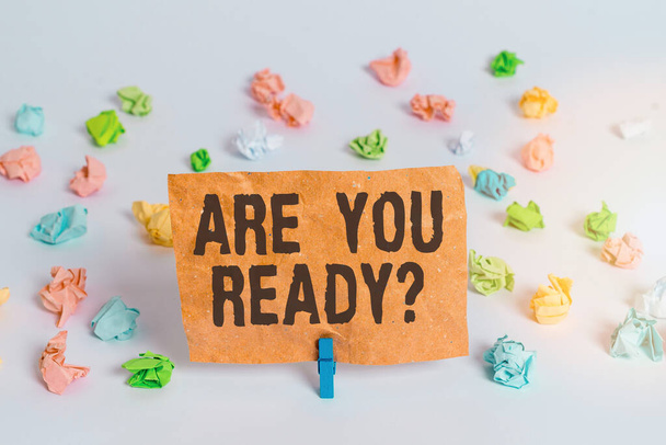 Conceptual hand writing showing Are You Ready Question. Business photo text used telling someone start something when feel prepared Colored crumpled paper empty reminder white floor clothespin. - Photo, Image