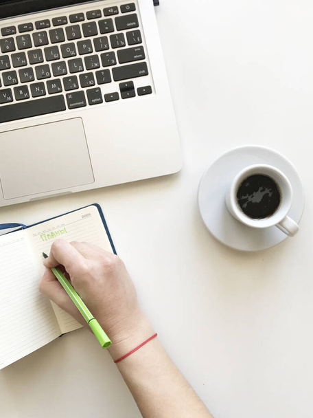 coffee mug newspaper and laptop on office desk - Valokuva, kuva