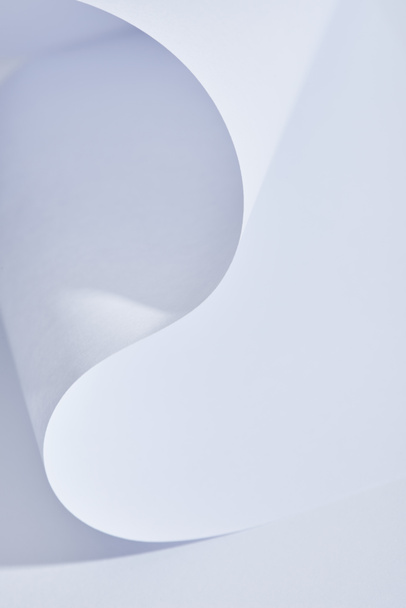 close up view of curved paper sheet on white background - Valokuva, kuva