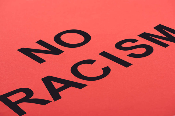black no racism lettering on red background - Photo, Image