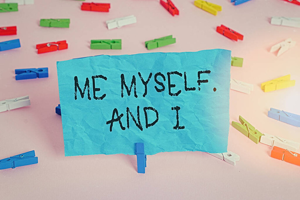 Conceptual hand writing showing Me Myself And I. Business photo showcasing used by speaker to refer to herself as the object of a verb Colored clothespin papers empty reminder pink floor office. - Photo, Image
