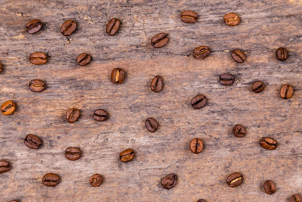 Aromatic coffee beans on white wooden table. Top view. Banner - Photo, Image