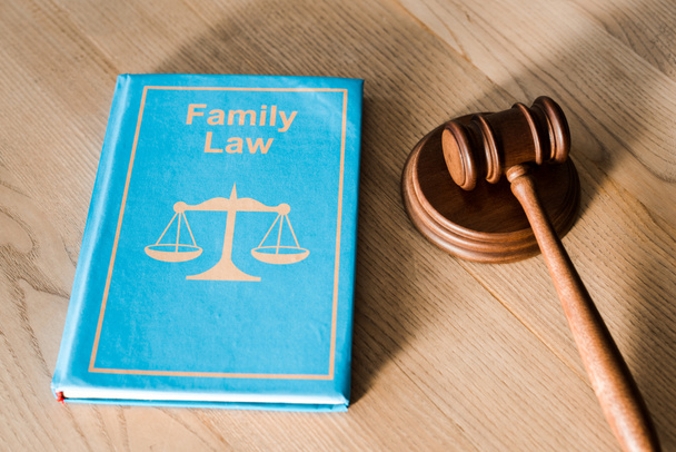 gavel near book with family law lettering on wooden desk - Photo, Image
