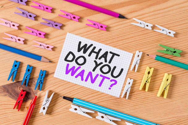 Conceptual hand writing showing What Do You Want Question. Business photo text say or write in order to ask about something Colored crumpled papers wooden floor background clothespin. - Photo, Image
