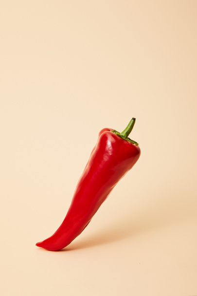 raw red hot chili pepper on beige with copy space  - Zdjęcie, obraz