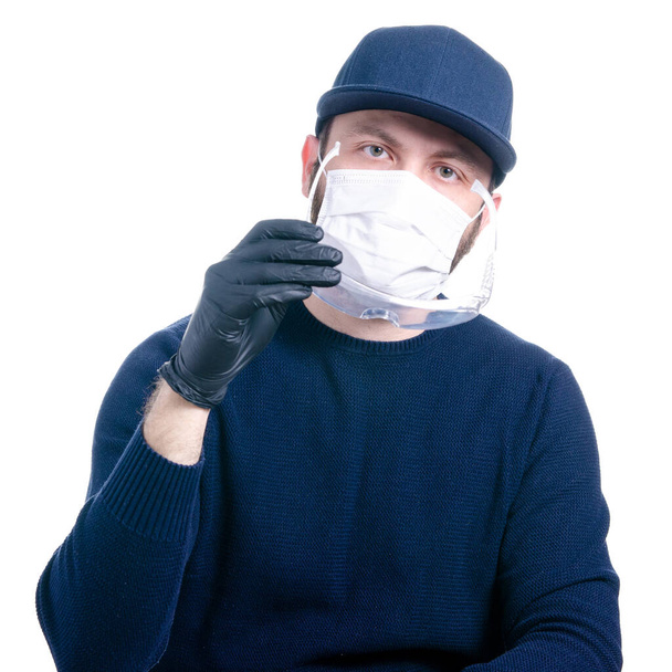 Man in medical protective mask and protective gloves, glasses virus - Fotó, kép