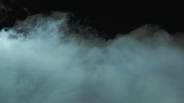 Photo of Realistic Clouds, fog, fume, haze, mist, vapor, smoke, dry ice smoke on black dark Background. Poster, Wallpaper, Texture, Banner, Still design. - Fotografie, Obrázek