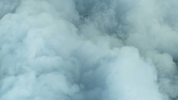 Photo of Realistic Clouds, fog, fume, haze, mist, vapor, smoke, dry ice smoke on black dark Background. Poster, Wallpaper, Texture, Banner, Still design. - Fotó, kép