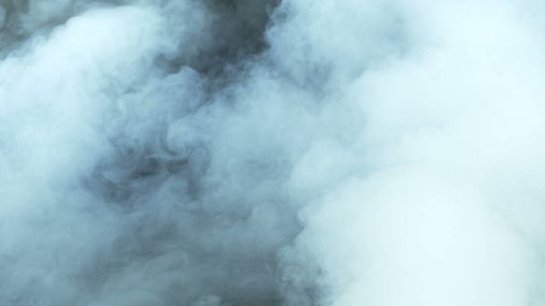 Photo of Real Smoke on a black background - realistic overlay for different projects. Clouds fog, mist, haze, vapor. - Фото, зображення