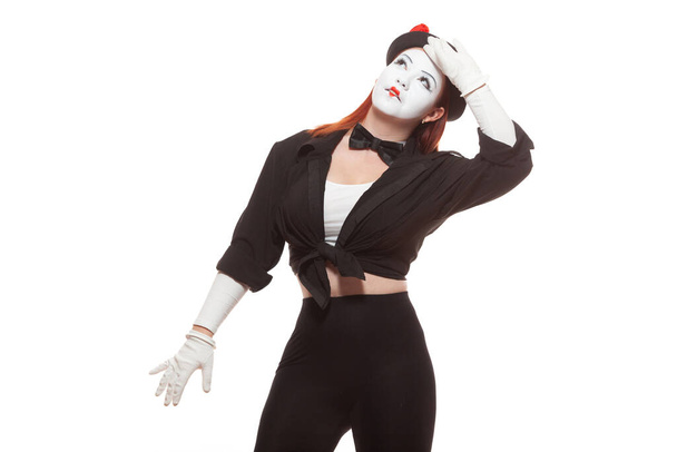 Portrait of a female mime artist performing, isolated on white background. Symbol of fatigue, tiredness, overwork, working overtime - Фото, изображение