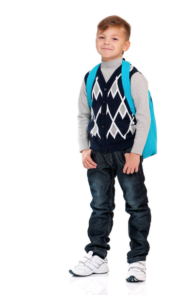 Full length portrait of caucasian little boy with backpack, isolated on white background. Cute child with bag back to school. - Photo, image