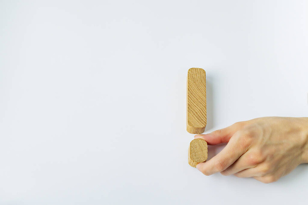 Collage of wooden blocks on a white background and human hands - Photo, image