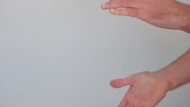 finger gesture of a european man on white background - Filmagem, Vídeo