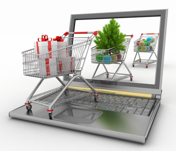 クリスマスのオンライン ショッピングの概念。ラップトップ コンピューターをお祭りのショッピング カート - 写真・画像