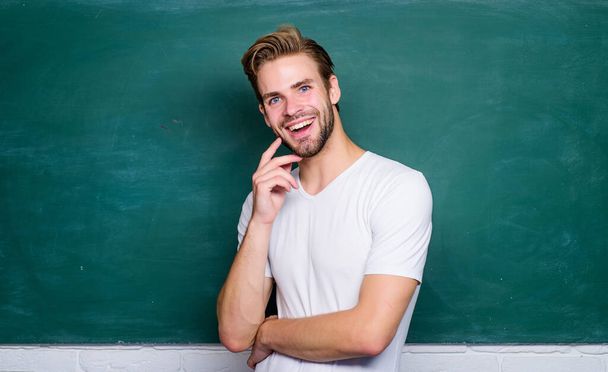 Master of simplification. Man teacher in front of chalkboard. Back to school. Advantages for male elementary teacher are abundant. Teaching could be more fun. Teacher best friend of learners - Photo, Image
