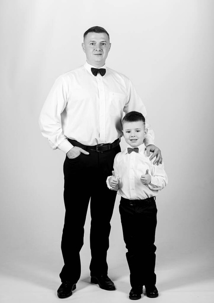 Father and son formal clothes outfit. Formal event. Grow up gentleman. Dad and boy with bow ties. Gentleman upbringing. Little son following fathers example of noble man. Gentleman upbringing - Fotó, kép