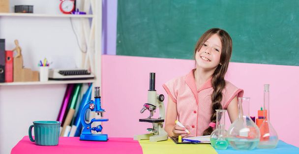 Testing samples. small girl with lab flask. science lesson with microscope. school laboratory. Modern technology. girl study chemistry with testing tube. back to school. biology education - Zdjęcie, obraz