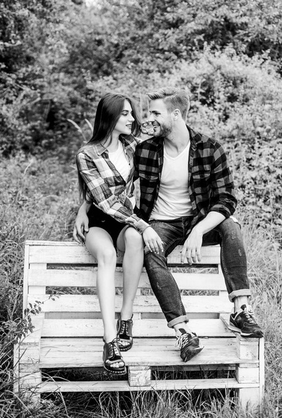 Boyfriend and girlfriend in love. Love and romance concept. Summer vacation. Enjoying nice weekend together. Family weekend. Romantic date in park. Couple in love sit on bench. Youth hang out - Foto, afbeelding
