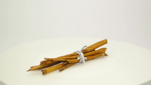 Bunch of cinnamon sticks tied with a grey ribbon FullHD 1080p - Footage, Video