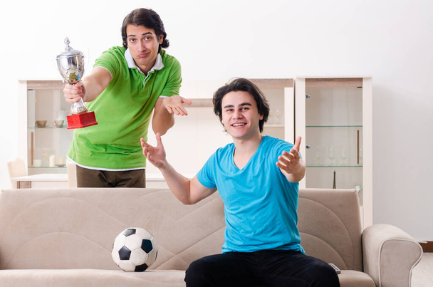 Friends watching football at home - Foto, imagen