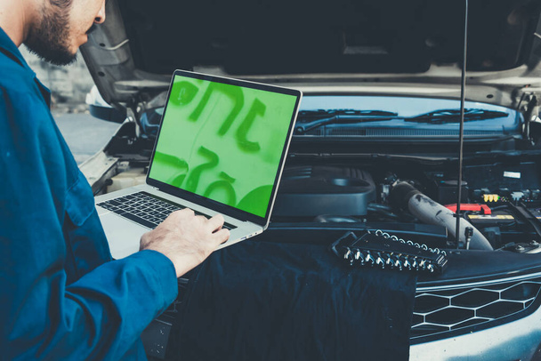 Professional mechanic providing car repair and maintenance service in auto garage. Car service business concept. - Fotó, kép