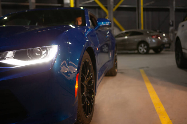 Cropped shot of a new sports car at the workshop, copy space - Photo, Image