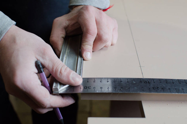 A man works in a carpentry workshop. - Fotografie, Obrázek