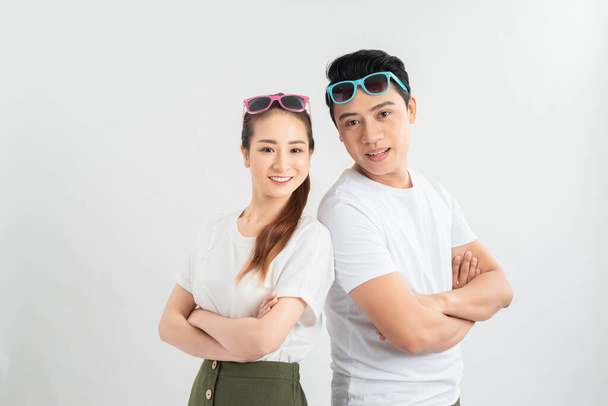 young couple smiling at the light on a light background - Photo, Image