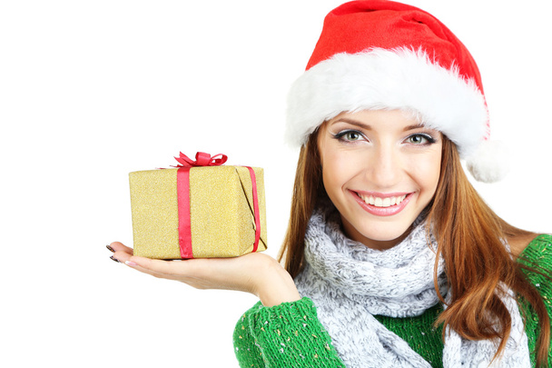 Beautiful smiling girl in New Year hat with gift isolated on white - Foto, imagen