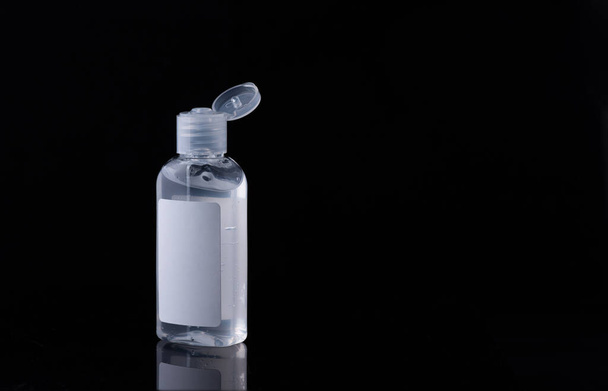 Bottle of antiseptic gel isolated on white, black background - Foto, imagen