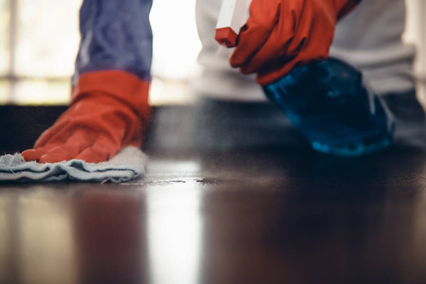 I'll keep wiping until its spotless. Cropped shot of an asian man cleaning a kitchen counter at home. Prevention of bacterial infection Coronavirus or Covid 19. - Valokuva, kuva