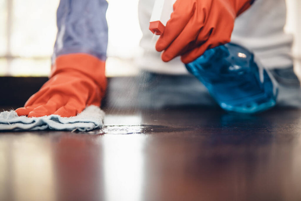 I'll keep wiping until its spotless. Cropped shot of an asian man cleaning a kitchen counter at home. Prevention of bacterial infection Coronavirus or Covid 19. - Foto, Imagen