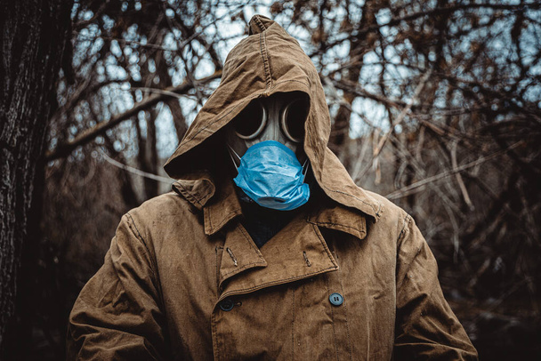 Man in protective suit during virus - 写真・画像