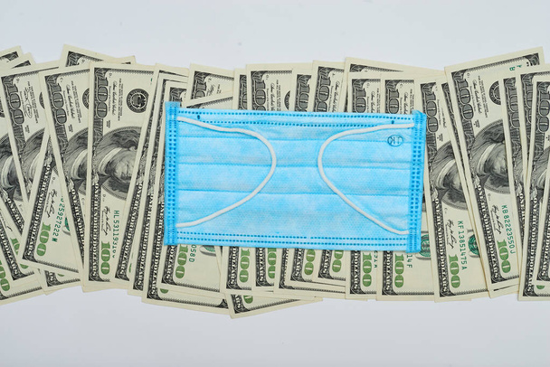 деньги долларов с лекарственной маской
 - Фото, изображение