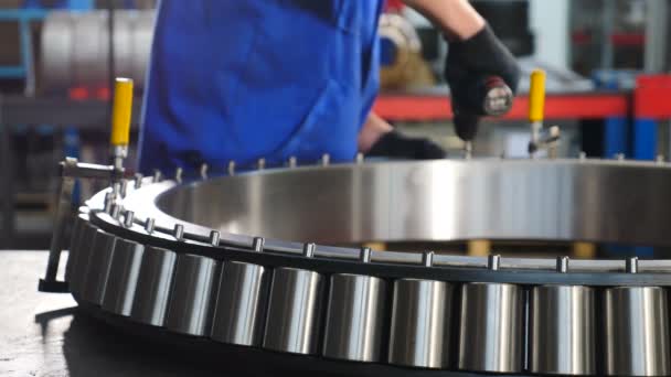 Conept of industry and manufacture. Bearing producing factory. Modern Factory. Hand manufacture of bearings at factory. Bearing production and assembling Close-up. 4k footage - Footage, Video