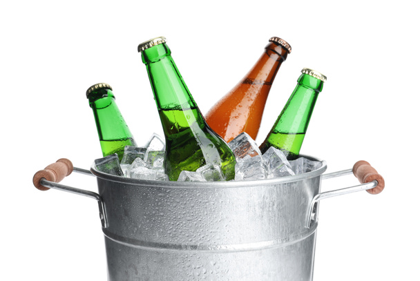Metal bucket with bottles of beer and ice cubes isolated on white - Фото, зображення