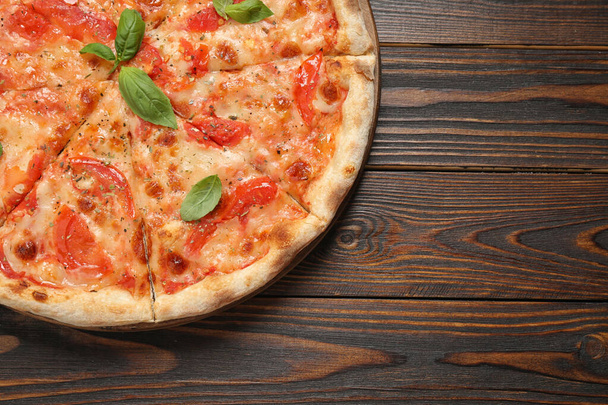 Delicious pizza Margherita on wooden table, top view. Space for text - Fotografie, Obrázek