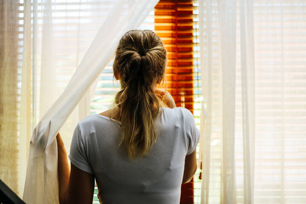 Woman stand alone at home for protection corona-2019 virus. - Φωτογραφία, εικόνα