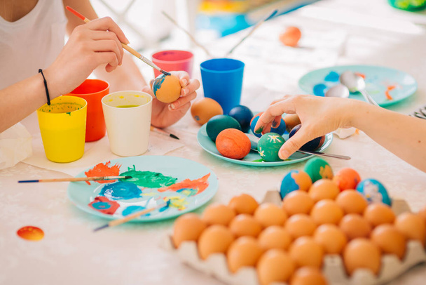 Family Easter Decoration Painting Eggs Mom with three kids - Φωτογραφία, εικόνα
