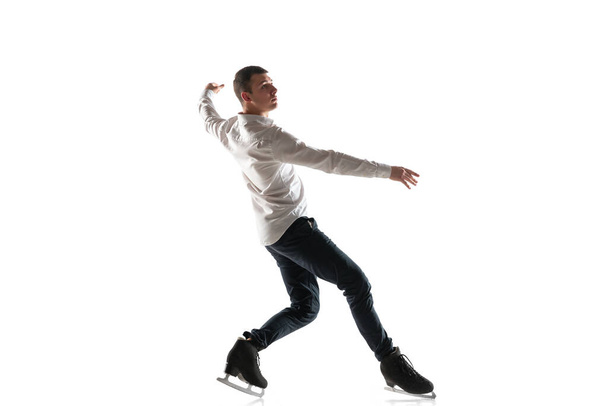 Man figure skating isolated on white studio backgound with copyspace - Zdjęcie, obraz