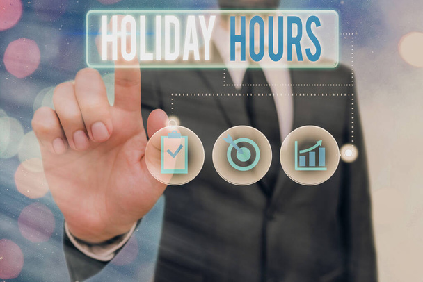 Word pisanie tekstu Holiday Hours. Koncepcja biznesowa dla pracownika otrzymuje dwa razy normalne wynagrodzenie za wszystkie godziny. - Zdjęcie, obraz